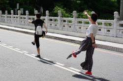 全红婵教练，10米台卫冕之路的引路人